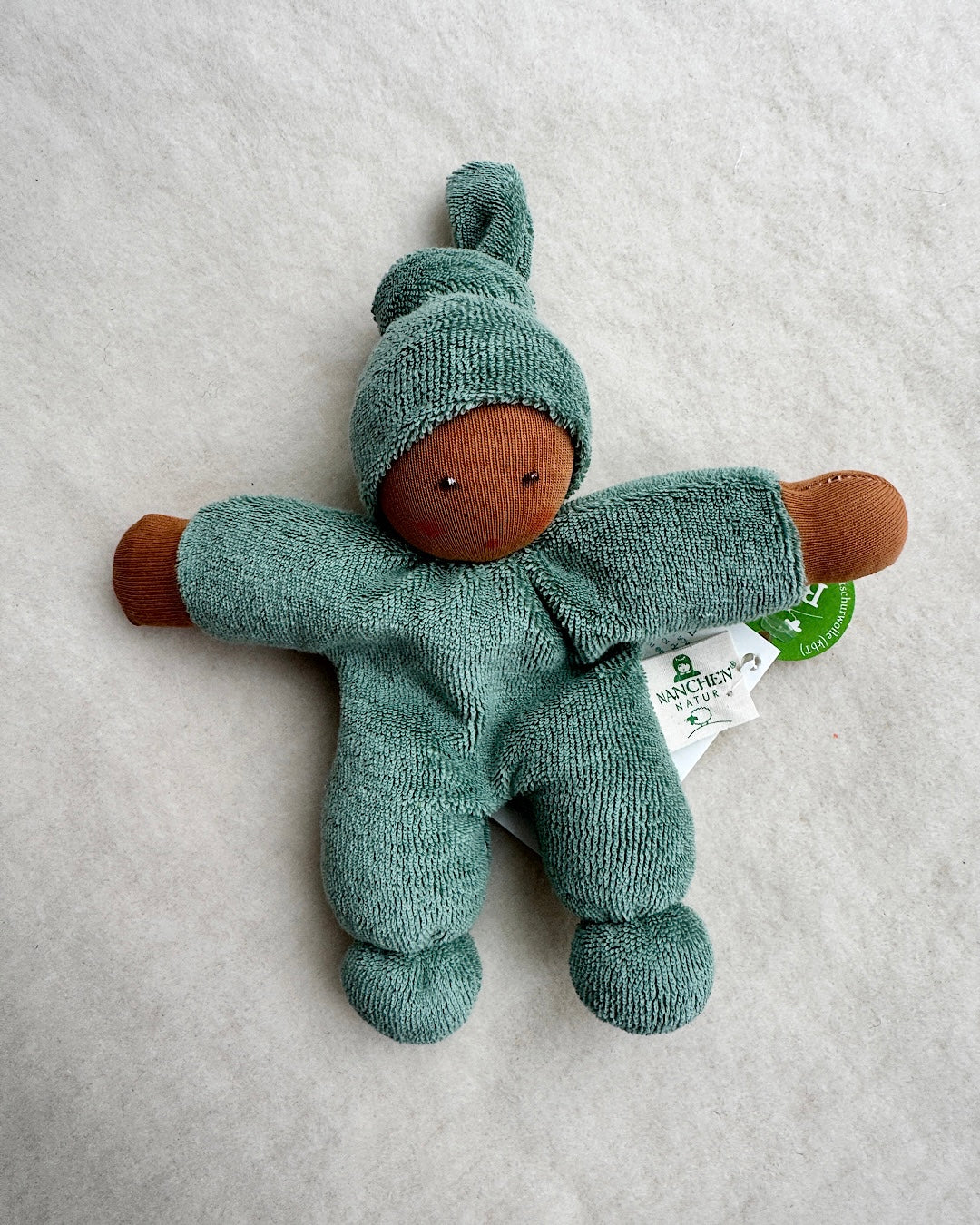 Håndsyet økologisk dukke - lys turkis